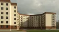 Кирпично-монолитный дом высотой 6 этажей.