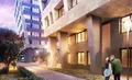 Фасад облицован натуральным камнем и панелями из архитектурной терракоты.